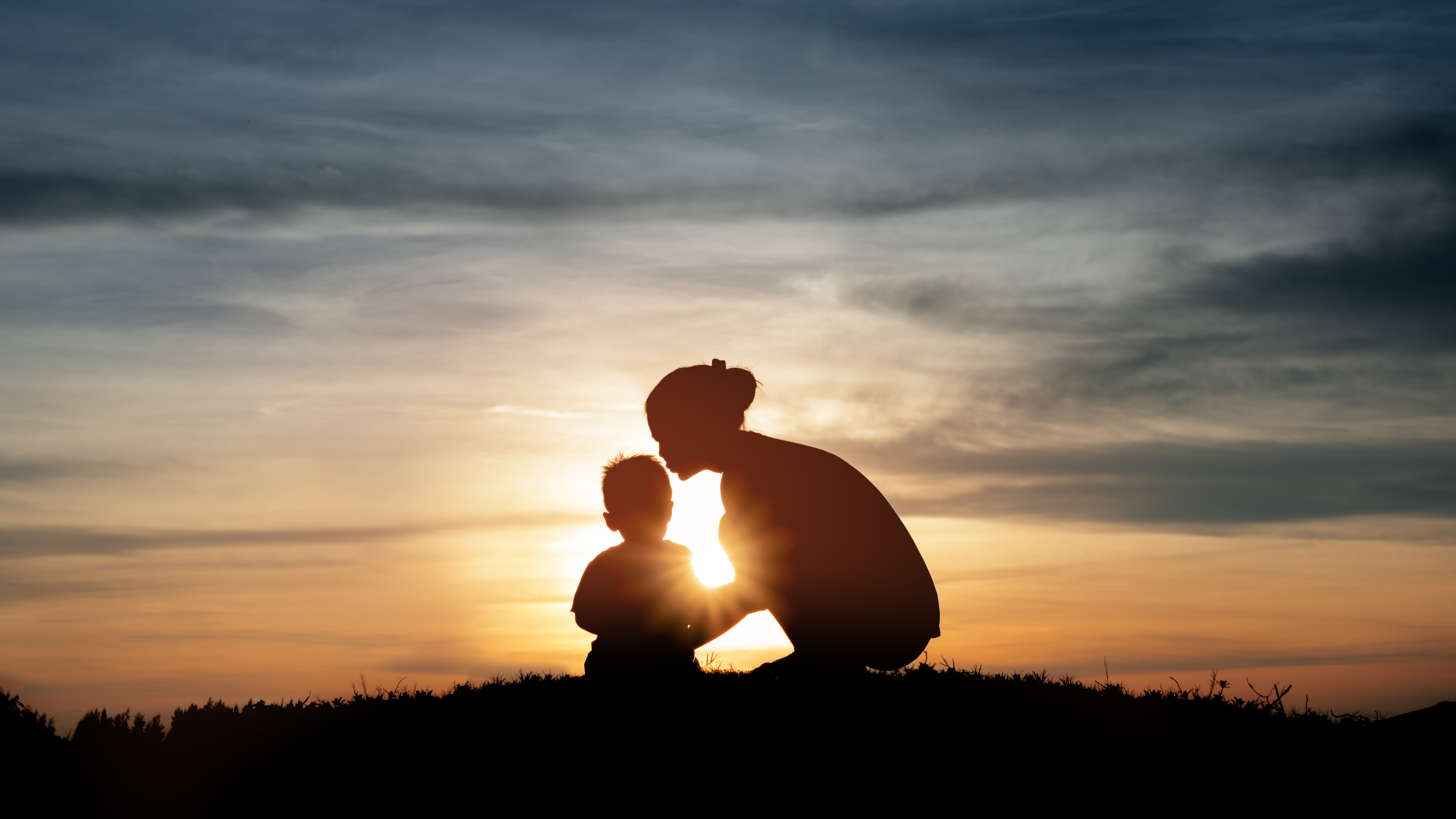 Silhouette of a young mother